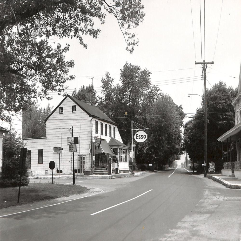 The store at the Edinburg crossroads with vintage Esso gas pumps out front